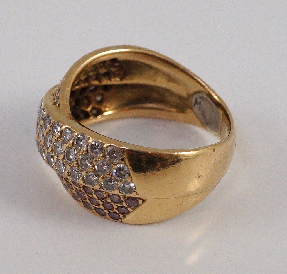 A modern gold (tests as 18ct), pink and white pave set diamond cross over ring, by Musson